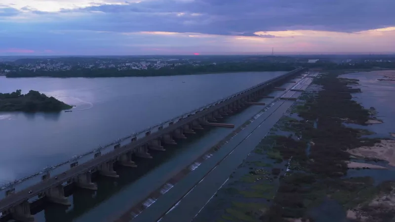 The Dowleswaram barrage striding across the Godavari at dusk, seen from the air