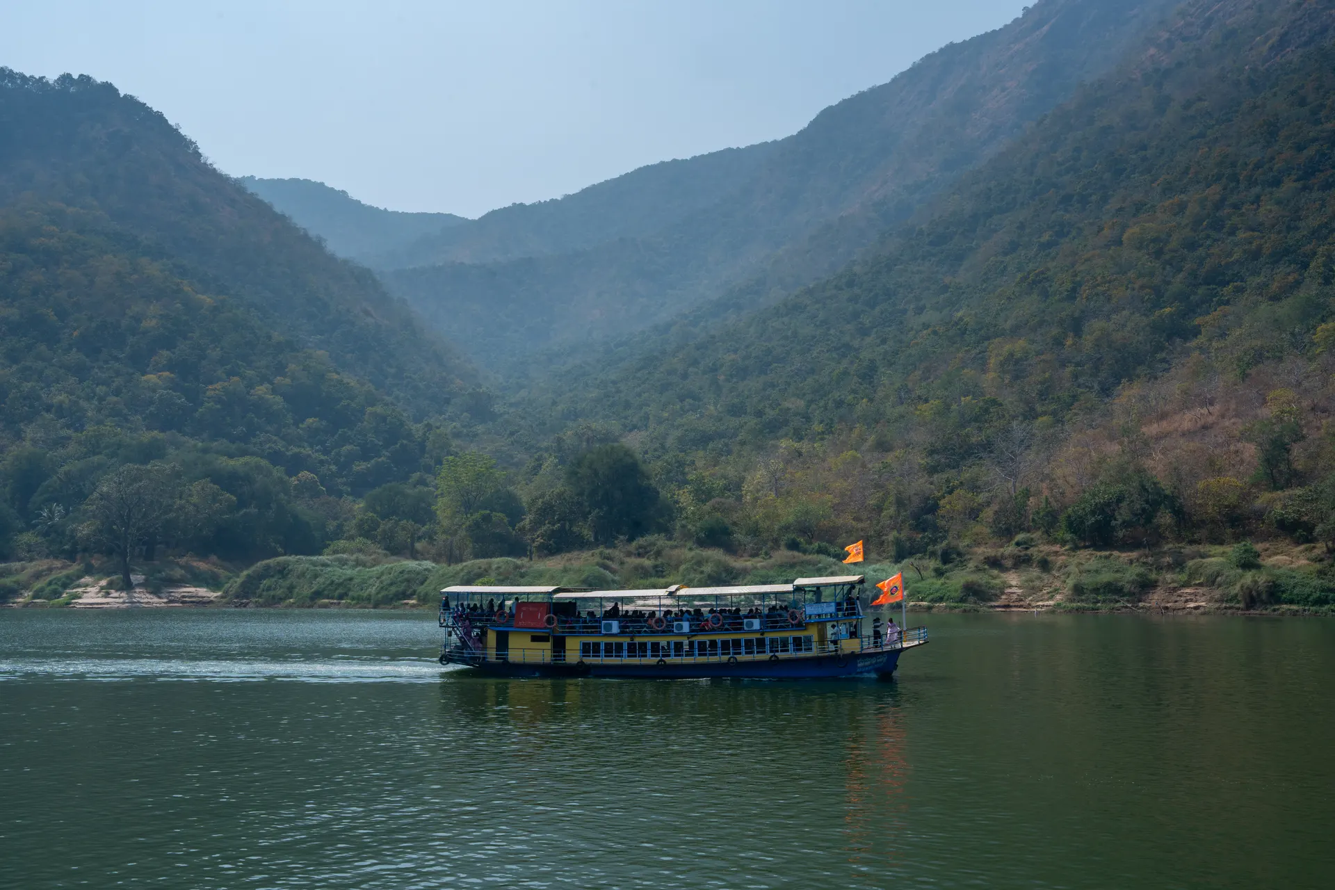 A launch cruising the forested Papikondalu gorge