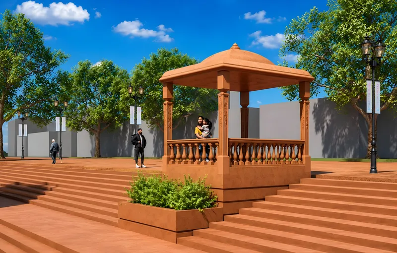 A domed sandstone pavilion with a balustrade on the ghat steps, families resting inside