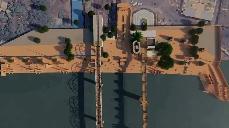 Aerial view of the redeveloped Pushkar Ghat: a long sandstone promenade along the river beside the rail bridge